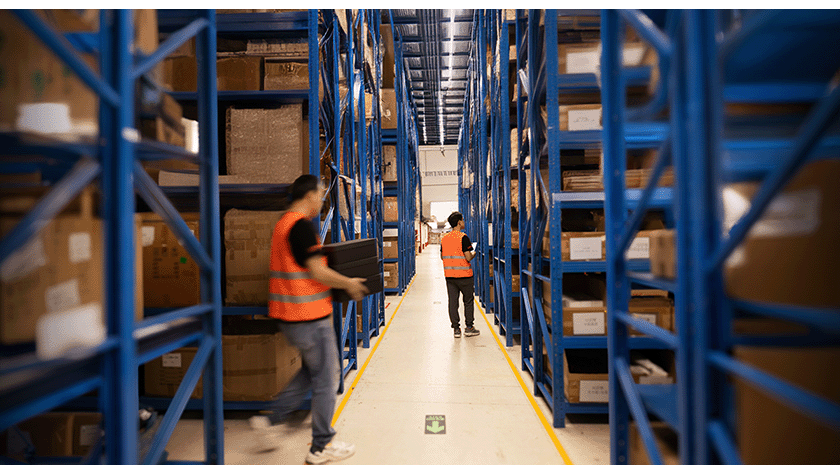 Workers in a fulfillment center vs a traditional warehouse